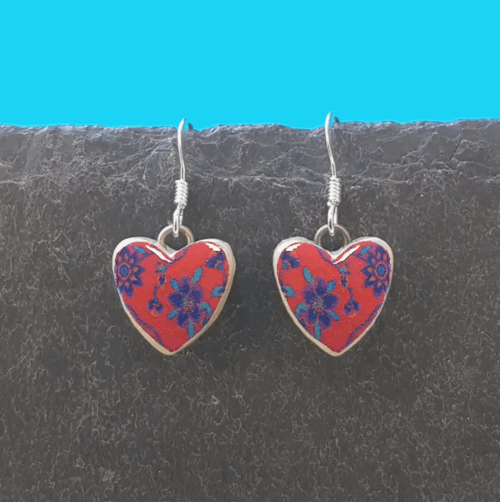 Purple flowers on red Ceramic heart earrings